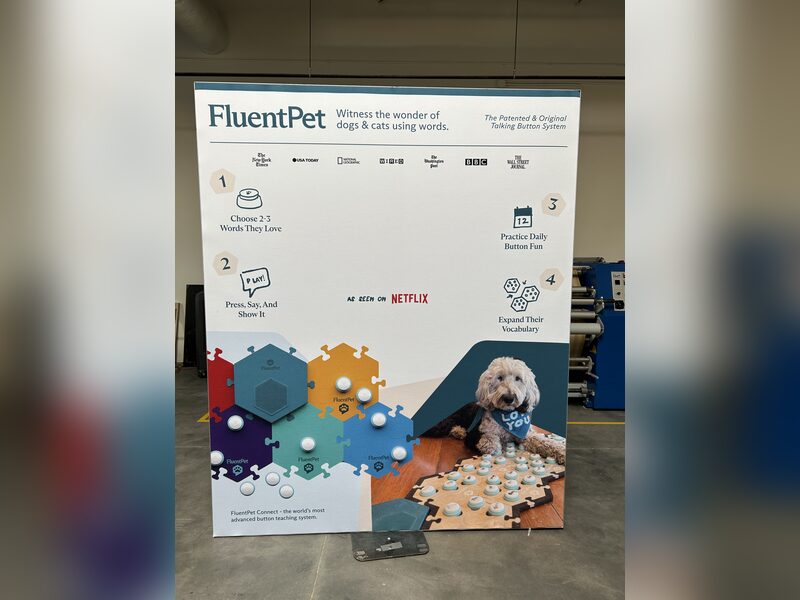 Freestanding FluentPet information display with illustrated buttons and a dog