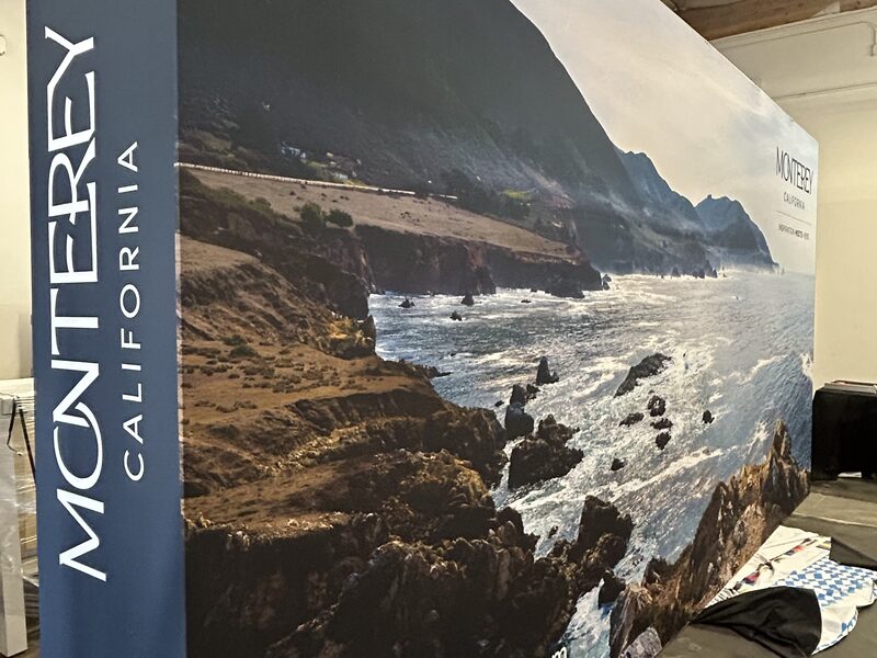 Monterey California coastal photography wrapped around an exhibit wall in production