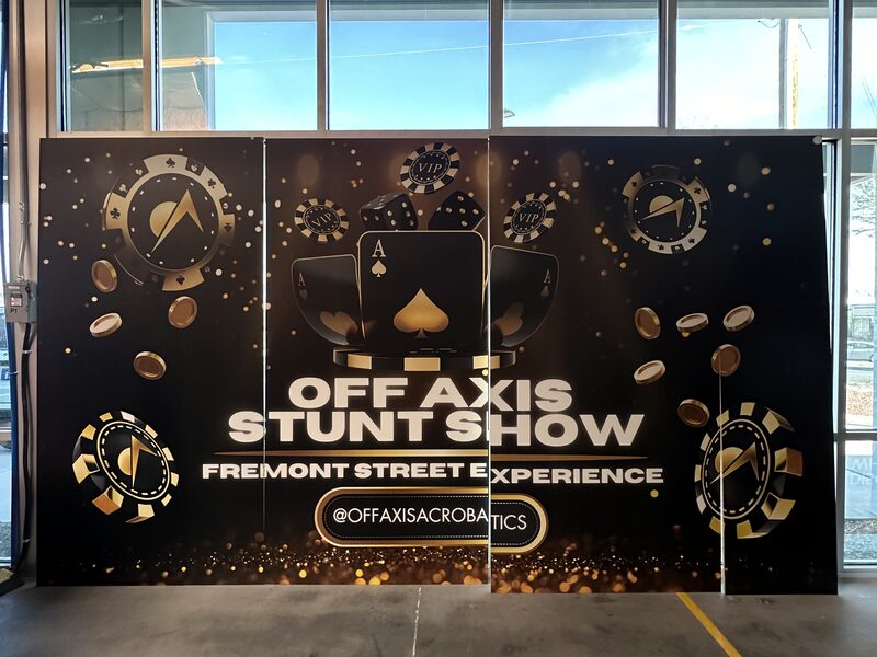 Black Off Axis Hunting Show wall with gold circular graphics erected indoors
