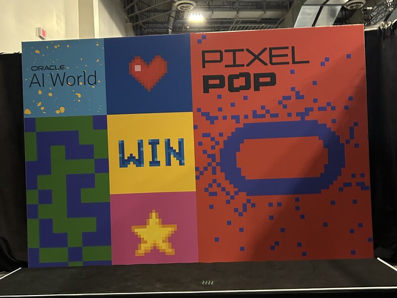 Colorful Pixel Pop branded photo wall with block graphics and large lettering