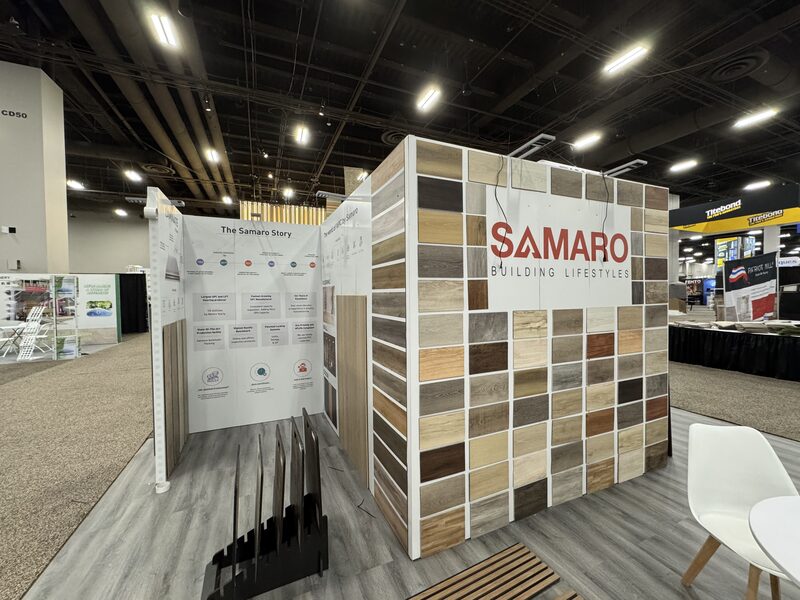 SAMARO trade show display with stone sample panels and white printed walls
