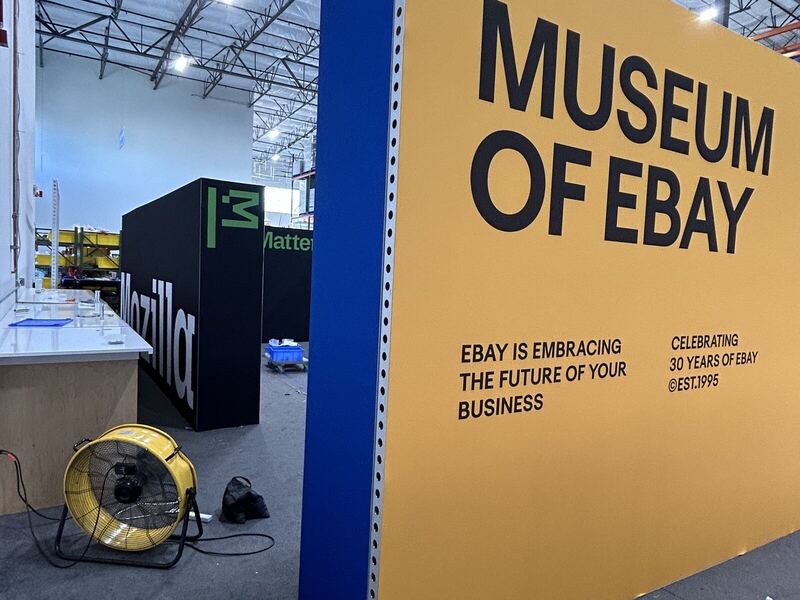 Large printed exhibit wall installed on a trade show floor