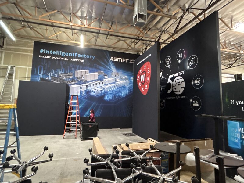 Large SKB Cases exhibit walls under construction with a ladder and tools nearby