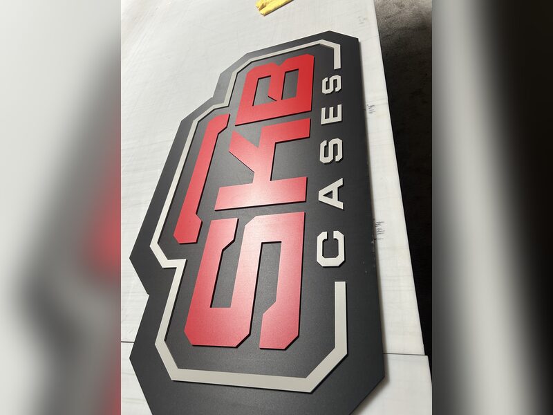 Red and black SKB Cases dimensional logo laid out during fabrication