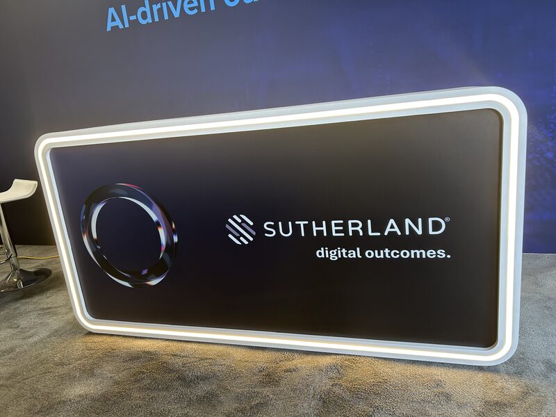 Backlit Sutherland Digital Outcomes display panel with an illuminated white border