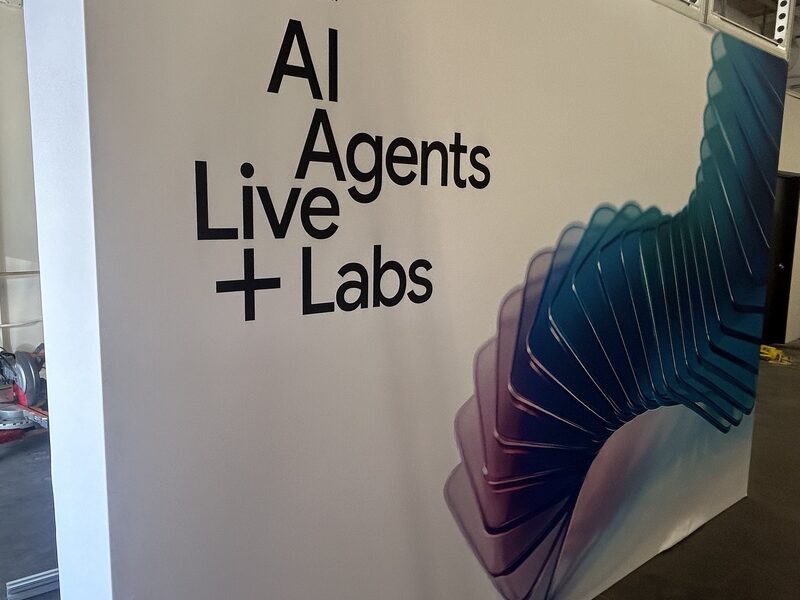 Large printed wall graphic about AI agents installed in an exhibit area