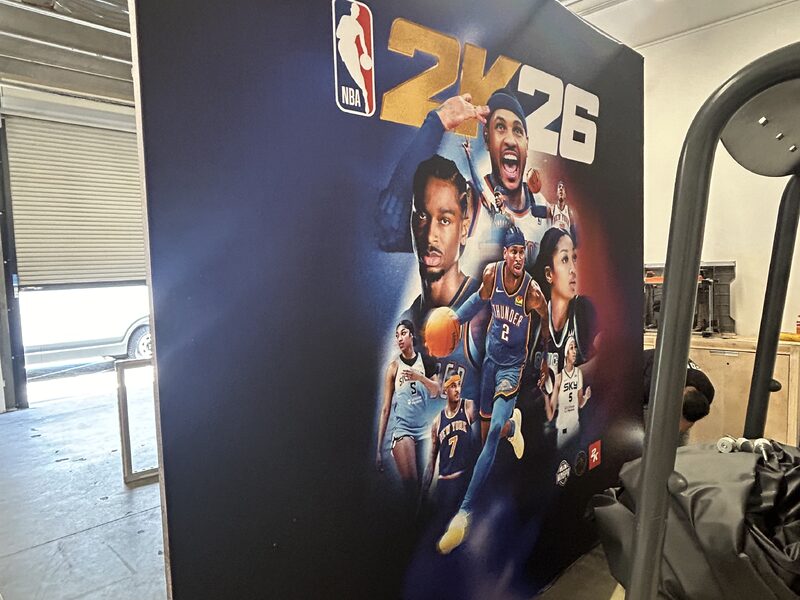 Large basketball player wall graphic installed beside an exhibit entrance