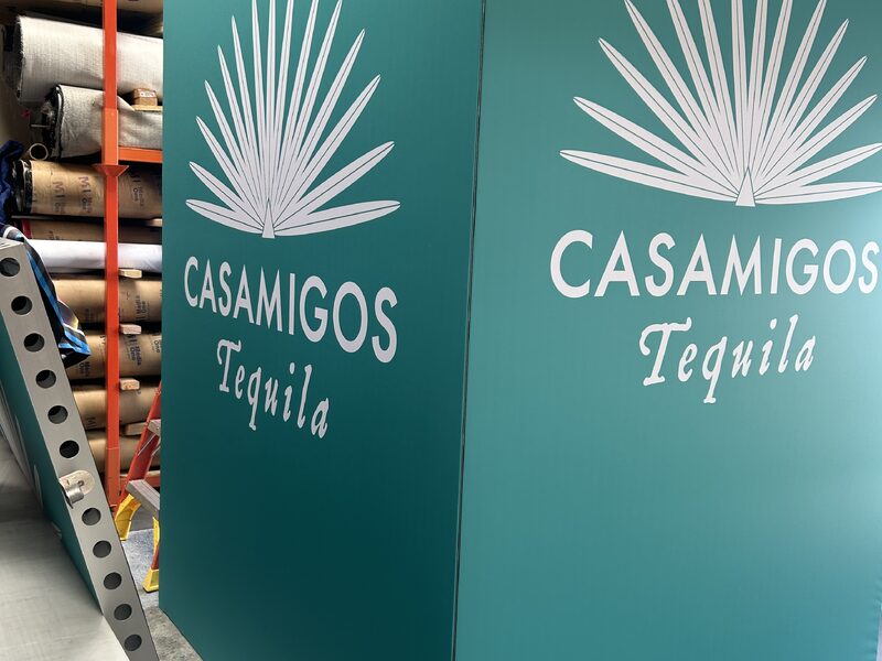 Set of tall Casamigos-branded display panels in an exhibit hall