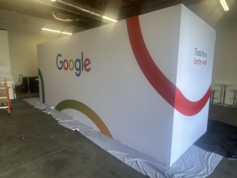 Large Google-branded printed wall graphic installed in an exhibit space