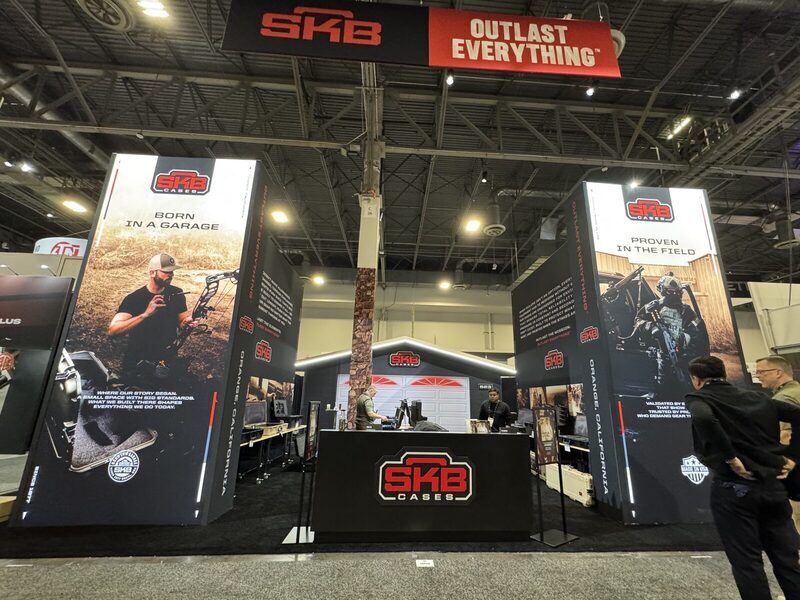 Trade show island exhibit with large format graphics — printed by Red Bliss, Las Vegas