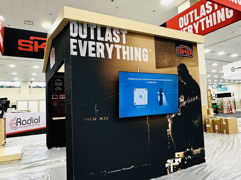 Freestanding SKB display panels with printed product graphics on a trade show floor