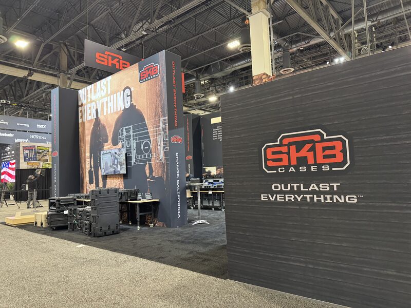 Tall SKB product display with printed panels and mounted equipment
