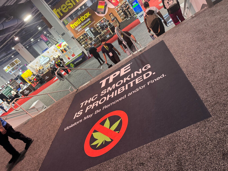 TPE anti-smoking floor graphic installed in a trade show aisle