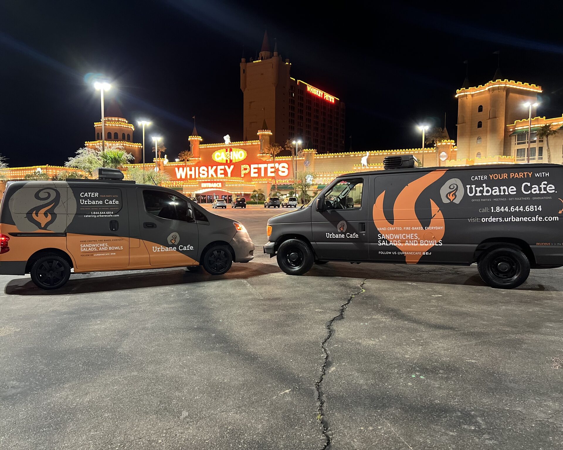 Wrapped catering vans on the Las Vegas Strip — vehicle wraps by Red Bliss